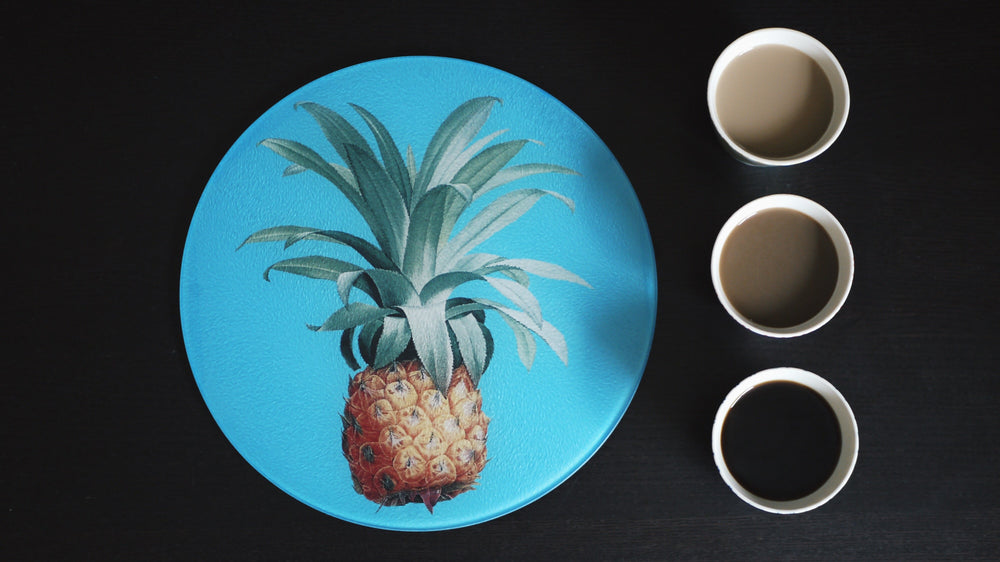 
            
                Load image into Gallery viewer, Pineapple Blue Glass Worktop Saver - Chopping Board - Placemat - Kitsch Republic
            
        